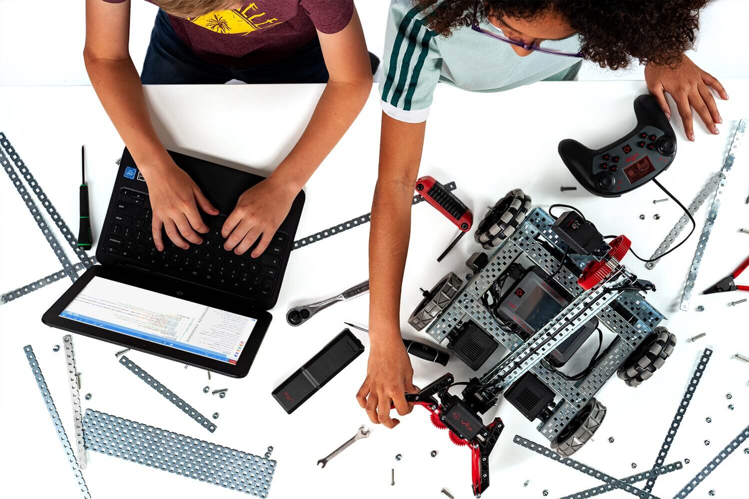 Kids at desk with VEX V5 Robot